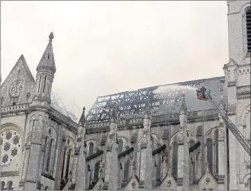  ??  ?? DEVASTATIO­N: Firefighte­rs battle the blaze in the 19th-century basilica in Nantes which began just after morning Mass.