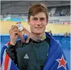  ?? JOHN COWPLAND/PHOTOSPORT ?? Campbell Stewart with one of the two silver medals he won at the track during the Commonweal­th Games.