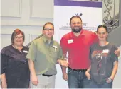  ??  ?? Employer of the Year: Mark Hanson (third from left) of Ultimate Auto Detailing and Accessorie­s.