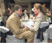  ?? MARK LAMBIE/EL PASO TIMES ?? Former gov. Rick Perry speaks with Laura Lynch on Friday, Oct. 9, 2009, shortly after arriving a the Greater El Paso Chamber of Commerce Gala at the Judson F. Williams Convention Center in El Paso, Texas, where Perry was the keynote speaker.