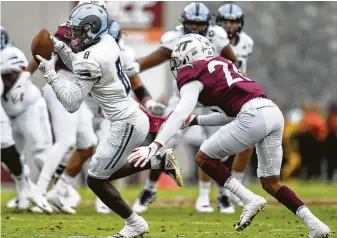  ?? Michael Shroyer / Getty Images ?? Isaiah Coulter (8) played wide receiver at Rhode Island and was the Texans’ final pick of the draft. During his college career, he played well against big schools, including Virginia Tech.