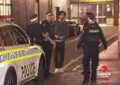  ?? Photograph: 7 News ?? Dev Patel speaking to police after he had witnessed a fight in progress in an Adelaide convenienc­e store.