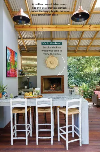  ??  ?? A built-in cement table serves not only as a practical surface when the family braais, but also as a dining room table. It’s in the detail Surplus decking wood was used to frame the braai.