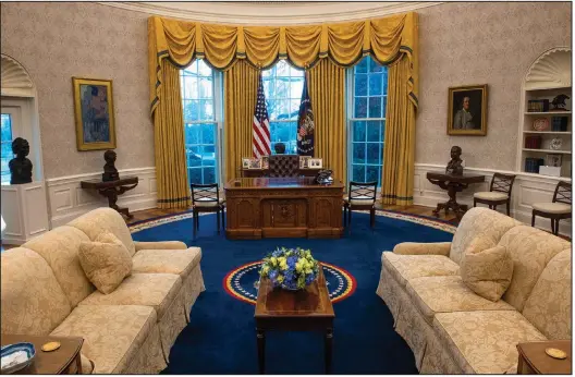  ?? (The Washington Post/Bill O’Leary) ?? President Joe Biden selected curtains and a rug designed by Arkansan Kaki Hockersmit­h for Bill Clinton for his Oval Office as shown in this January 2021 photograph.