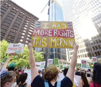  ?? PAUL BEATY/AP ?? Pro-choice supporters hold signs during a rally Friday in Chicago at Federal Plaza after the Supreme Court overturned Roe v. Wade.