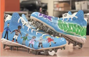  ?? CINCINNATI BENGALS ?? Cleats to be worn by Bengals defensive end Michael Johnson this weekend include the message, “I am part of the solution.”