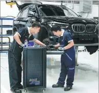  ?? PROVIDED TO CHINA DAILY ?? Engineers check facilities at BMW’s R&D center in Shenyang, Liaoning province.