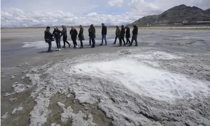  ?? Photograph: Rick Bowmer/AP ?? Elected Utah state officials inspect the shrinking Great Salt Lake in May.