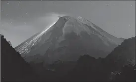  ?? AFP ?? In this July 18 photo, lava flows down Mount Merapi during an eruption.