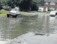  ??  ?? Johnson Way in Church Crookham, was hit by flash flooding following the afternoon storm last Friday.