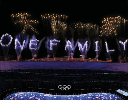  ?? XINHUA ?? Fireworks project “One Family” in Chinese and English after spelling out “One World” at the closing ceremony.