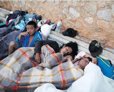  ?? FELIX MARQUEZ / THE ASSOCIATED PRESS ?? Migrants sleep in Matias Romero, Oaxaca State, Mexico on Tuesday. U.S. President Donald Trump referred to the caravan of Central Americans Tuesday, stating: “Republican­s must go to nuclear option to pass tough laws now.”