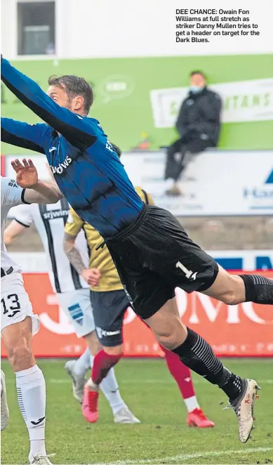  ??  ?? DEE CHANCE: Owain Fon Williams at full stretch as striker Danny Mullen tries to get a header on target for the Dark Blues.