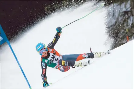  ?? Alexis Boichard Agence Zoom/getty Images ?? TED LIGETY, who won a gold medal for the U.S. in 2006, whisks along a course at a World Cup stop in Alta Badia, Italy, in December.