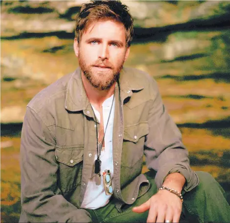  ??  ?? COURTESY OF CAL & ALY Country singer Canaan Smith has released two singles, “Country Boy Things” and “Beer Drinkin’ Weather.”