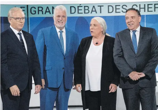  ?? PAUL CHIASSON/THE CANADIAN PRESS ?? PQ Leader Jean-François Lisée, Liberal Leader Philippe Couillard, Québec solidaire Leader Manon Massé and CAQ Leader François Legault ahead of the debate. In a twist for a Quebec election, much of the debate was focused on ideas and the kind of government the parties are offering taxpayers, instead of the sovereignt­y-federalism debate.