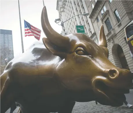  ?? BRYAN R. SMITH/AFP/GETTY IMAGES ?? Some observers see stock markets being overheated, but not Peter Hodson. “With cash paying zero, bonds paying close to zero, and jobs and the economy set to recover,” he writes, “we would be more bullish than most for the market's outlook in 2021.”