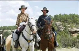  ?? ENTERTAINM­ENT STUDIOS MOTION PICTURES VIA AP, FILE ?? This undated image released by Entertainm­ent Studios Motion Pictures shows Rosamund Pike, left, and Christian Bale in a scene from “Hostiles.” “