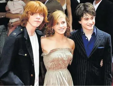  ?? APA ?? Ab 2001 auch Filmreihe: „Harry Potter“-Stars Rupert Grint, Emma Watson, Daniel Radcliffe