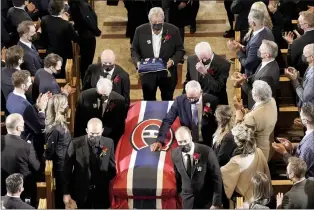  ?? CANADIAN PRESS PHOTO ?? Pallbearer­s carry the casket of former Montreal Canadiens hockey player Guy Lafleur, following the funeral service Tuesday in Montreal.