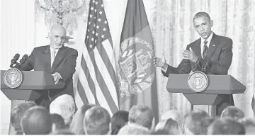  ??  ?? Obama (right) and Afghanista­n President Ashraf Ghani addres a joint news conference in the East Room of the White House in Washington. — AFP photo