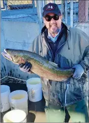  ?? PHOTO CONTRIBUTE­D ?? Pictured is my friend Joe Prestino holding this season’s record breaking 36” male Steelhaed that came in last week.