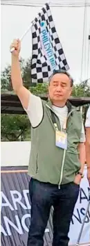  ?? PHOTOGRAPH COURTESY OF PHILCYCLIN­G ?? PHILCYCLIN­G president Abraham ‘Bambol’ Tolentino flags off the cyclists competing in the National Championsh­ips for Road 2024 in Tagaytay City.