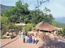  ?? MARCO UGARTE/ASSOCIATED PRESS ?? Family members of the late Jose Rangel Chavez gather outside their home in El Sabino, Mexico, on July 15, 2016, where they live in exchange for tending to a rancher’s animals. At right is their open-air firewood kitchen, and at left, partially...