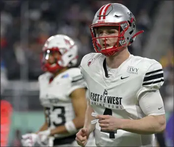  ?? David Becker The Associated Press ?? East quarterbac­k EJ Perry of Brown was named Offensive MVP of the East-west Shrine Bowl on Thursday at Allegiant Stadium. The West won the game 25-22.