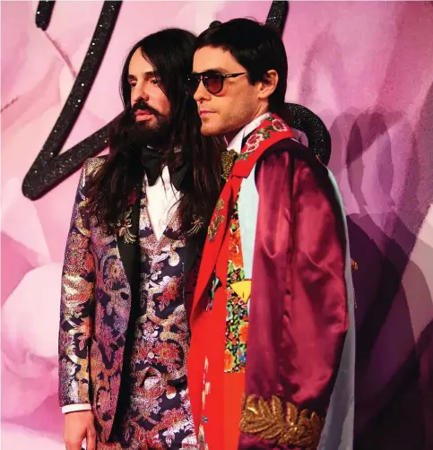  ??  ?? BROTHERS IN ARMS Le  and on previous page, Gucci’s creative director Alessandro Michele, le , and actor Jared Leto at the Fashion Awards in London. Below, the new Gucci Guilty Absolute fragrance.