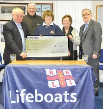  ??  ?? Thomas O’Callaghan from Dingle (right) presenting a cheque for 1,500 to Teresa Young of Kilrush INLI, with a little help from Joe Queally and Mattie and Celia Ryan. The money was raised from sales of Thomas’s CD ‘Dingle Bay’ which was recorded as a...