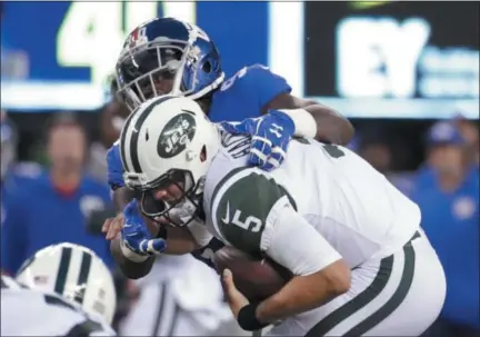  ?? JULIO CORTEZ — THE ASSOCIATED PRESS ?? New York Giants defensive end Jason Pierre- Paul ( 90) sacks NewYork Jets' Christian Hackenberg ( 5) during the first half of a preseason NFL football game Saturday in East Rutherford, N. J.