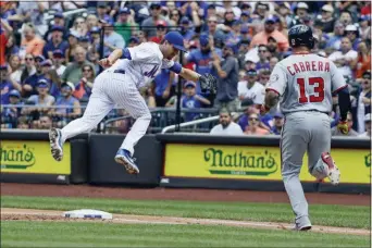  ?? FRANK FRANKLIN II — THE ASSOCIATED PRESS ?? Nationals’ Bob Henley (13) watches as Mets starting pitcher Jacob deGrom loses control of the ball on a throwing error by first baseman Pete Alonso during Sunday’s game in New York.