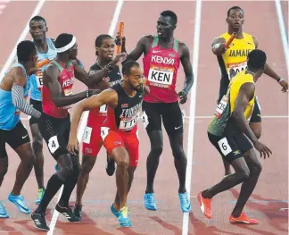  ?? Picture: GETTY IMAGES ?? Athletes at the baton exchange in the Men's 4x400m relay final.