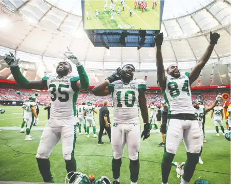  ?? DARRYL DYCK/THE CANADIAN PRESS FILES ?? New CFLPA president and Saskatchew­an linebacker Solomon Elimimian, centre, seen with Dyshawn Davis, left, and Emmanuel Arceneaux, is working with the league as the situation surroundin­g the upcoming season continues to shift due to the pandemic.