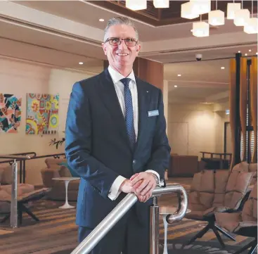  ??  ?? WELCOME BACK: Reef Hotel Casino general manager Wayne Reynolds is pleased to reopen the hotel's doors after being closed for three months during the lockdown. Picture: BRENDAN RADKE