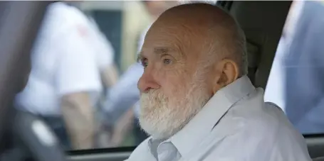  ?? MARY SCHWALM / BOSTON HERALD FILE ?? NO SET ADDRESS: Wayne Chapman sits on the front passenger seat of a vehicle outside of Middlesex County Superior Court in Woburn after being released on Friday.