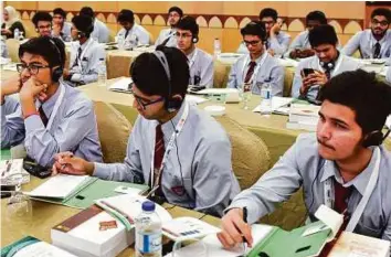  ?? Ahmed Ramzan/Gulf News ?? Students attend a session on the dangers of digital stimulants and the absence of legislatio­n during the 6th Internatio­nal Conference of Sport Versus Crime in Dubai yesterday.
