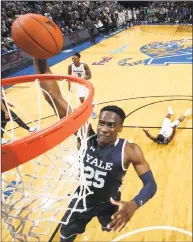  ?? Joe Murphy / Getty Images ?? Yale’s Miye Oni dunks the ball against Memphis on Nov. 17 at FedEx Forum in Memphis, Tennessee.