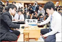  ??  ?? (AP) In this June 26, 2017 photo, Sota Fujii (right), replays a move against Yasuhiro Masuda in front of media after Fujii defeated Masuda to break a 30-year-old record with his 29th win in a row, in the qualifying round of a major tournament in Tokyo....