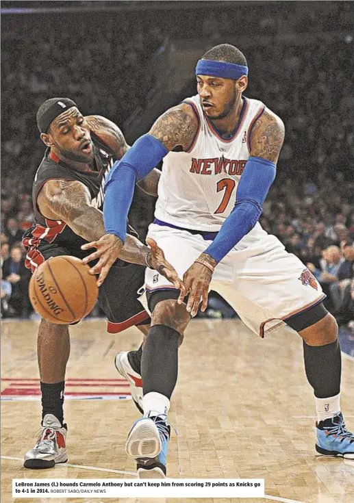  ??  ?? LeBron James (l.) hounds Carmelo Anthony but can’t keep him from scoring 29 points as Knicks go to 4-1 in 2014.
ROBERT SABO/DAILY NEWS