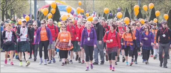  ?? Pictures: Elaine Livingston­e ?? Thousands of walkers took to the city’s streets for the Royal Bank of Scotland Kiltwalk