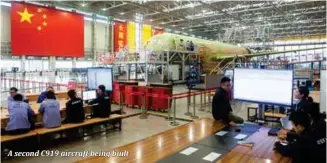  ??  ?? A second C919 aircraft being built