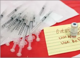  ?? The Canadian Press ?? A Pfizer-BioNTech COVID-19 vaccine vial is seen loaded with the vaccine at a pop-up COVID-19 vaccinatio­n site, Tuesday.
