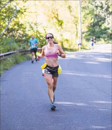  ?? Contribute­d photo / ?? Sharon Rosenblatt competes in the Pamby Ridgefield Half Marathon last October. Rosenblatt is currently running or walking every street in Ridgefield.