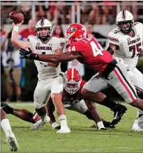  ?? Tribune News Service/the State ?? South Carolina quarterbac­k Luke Doty (4) is taken down by Georgia defensive lineman Travon Walker (44) on Sept. 18, 2021.