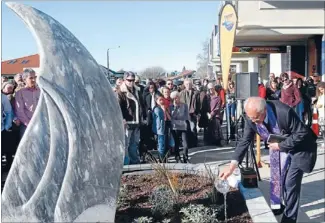  ??  ?? Blessing: Archdeacon Andy Joseph, the Tasman District Council kaumatua, pours water at the unveiling of Bruce Mitchell’s sculpture, Kaka Beak.