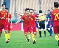  ?? GUO YONG / XINHUA ?? Team China celebrates a goal against Croatia in the first China Cup tournament in Nanning, Guangxi Zhuang autonomous region, in January. The Wanda-founded annual event is an official FIFA tournament, with results counting toward the world rankings.