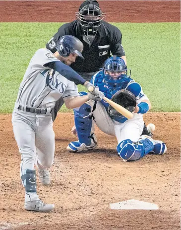  ?? USA TODAY SPORTS ?? The Rays’ Brandon Lowe hits a two-run home run against the Dodgers during the fifth inning in Game Two.