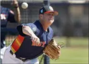  ?? JEFF ROBERSON — THE ASSOCIATED PRESS ?? In this file photo, Houston Astros pitcher Brad Peacock throws live batting practice during spring training baseball practice in West Palm Beach, Fla. Last spring Brad Peacock entered Astros camp worried that he wouldn’t make the team.